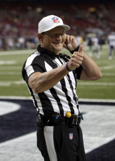 Referee Ed Hochuli is seen before the start of an NFL football game between the St. Louis Rams and the Minnesota Vikings Sunday, Sept. 7, 2014, in St. Louis. (AP Photo/Tom Gannam)