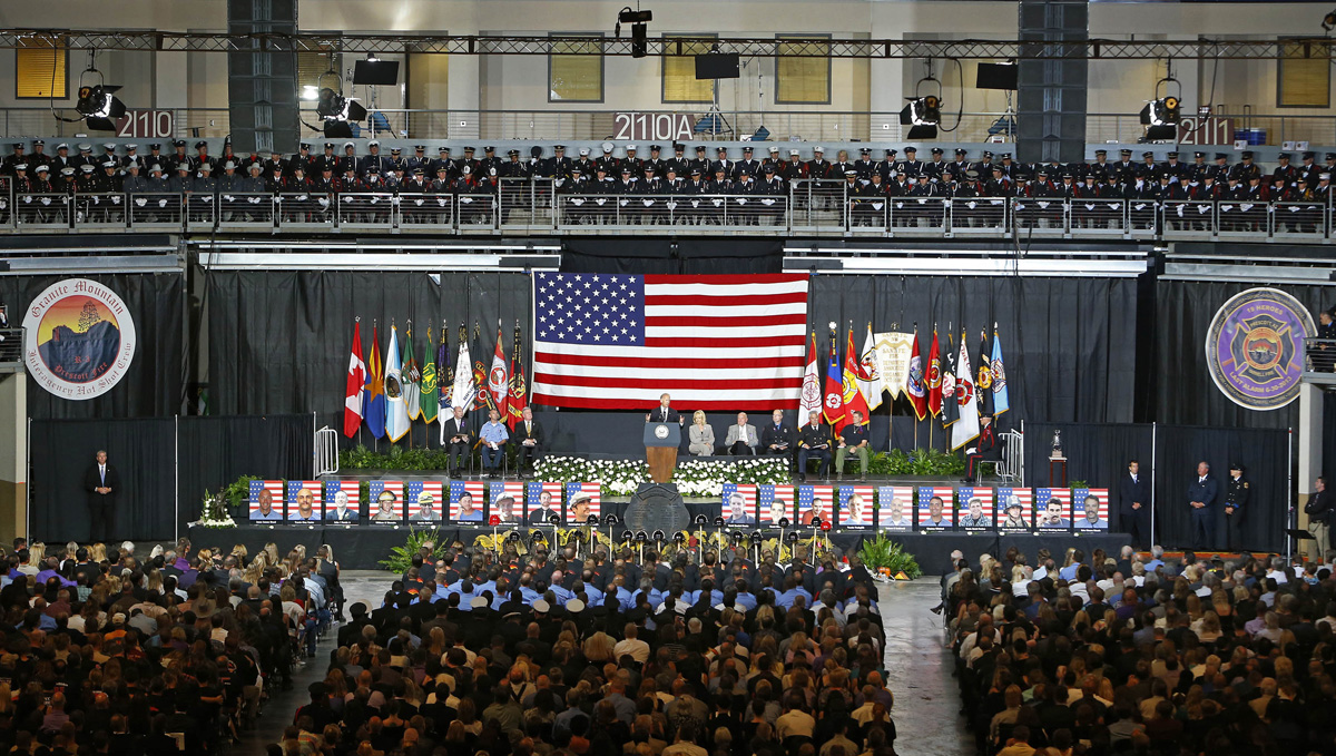 Vice President  Joe Biden speaks during a memorial service for the 19 fallen firefighters at Tim's Toyota Center in Prescott Valley, Ariz. on Tuesday, July 9, 2013.   Prescott's Granite Mountain Hotshots were overrun by smoke and fire while battling a blaze on a ridge in Yarnell, about 80 miles northwest of Phoenix on June 30, 2013.   (AP Photo/The Arizona Republic, David Kadlubowski, Pool)