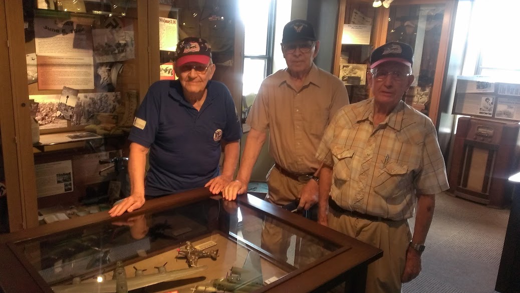 Three Luverne veterans visit the Herreid Military Museum. Left to right: Warren Herreid, Ray Anderson, Helmer Haakenson. MPR Photo/Bob Collins