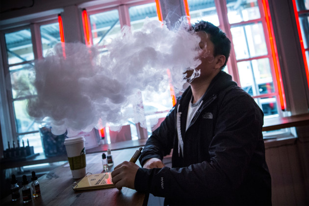 Tom Kim vapes an e-cig in New York City. (Andrew Burton/Getty Images)