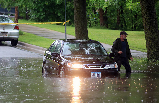 A car is stalled on a flooded S. James Avenue near W. 50th Street in Minneapolis as flash floods ripped through Minnesota June 19, 2014. Jeffrey Thompson/MPR News