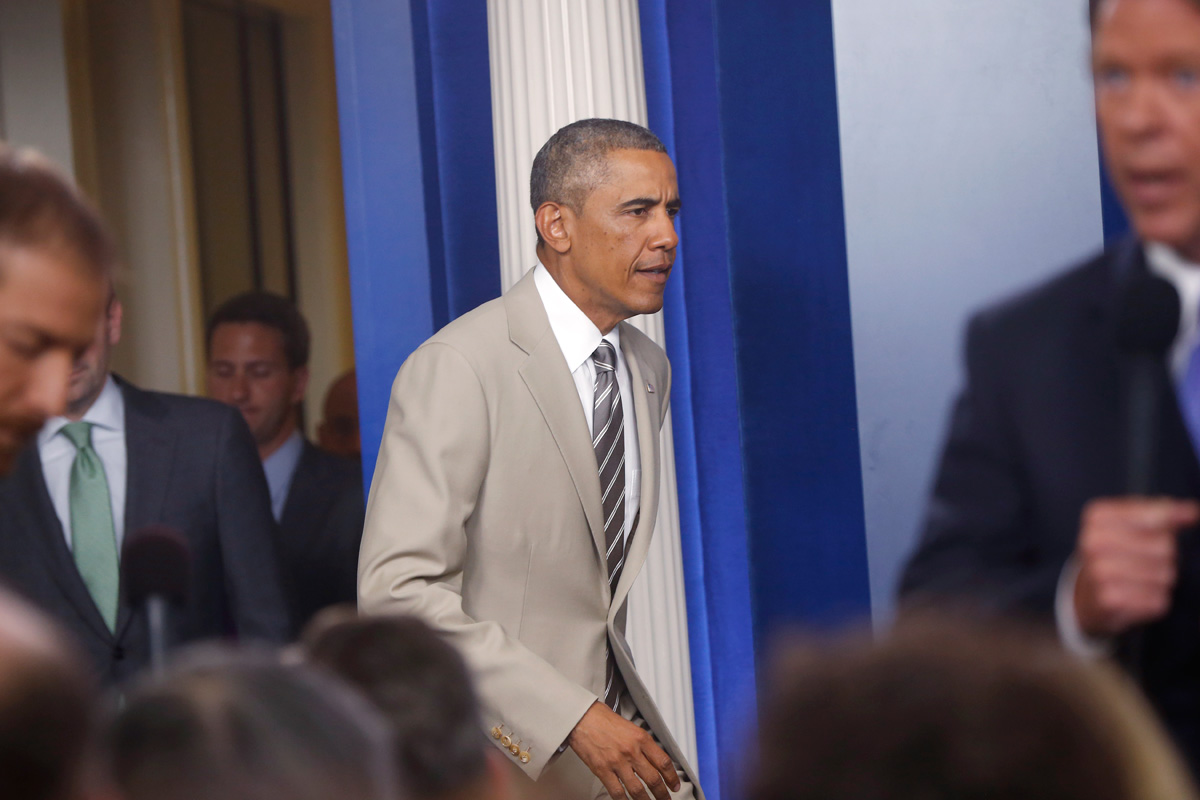 President Barack Obama arrives in the James Brady Press Briefing Room at the White House in Washington, Thursday, Aug. 28, 2014, to speak to reporters before convening a meeting with his national security team on the militant threat in Syria and Iraq. Obama also spoke about the economy and Ukraine. AP Photo/Charles Dharapak.