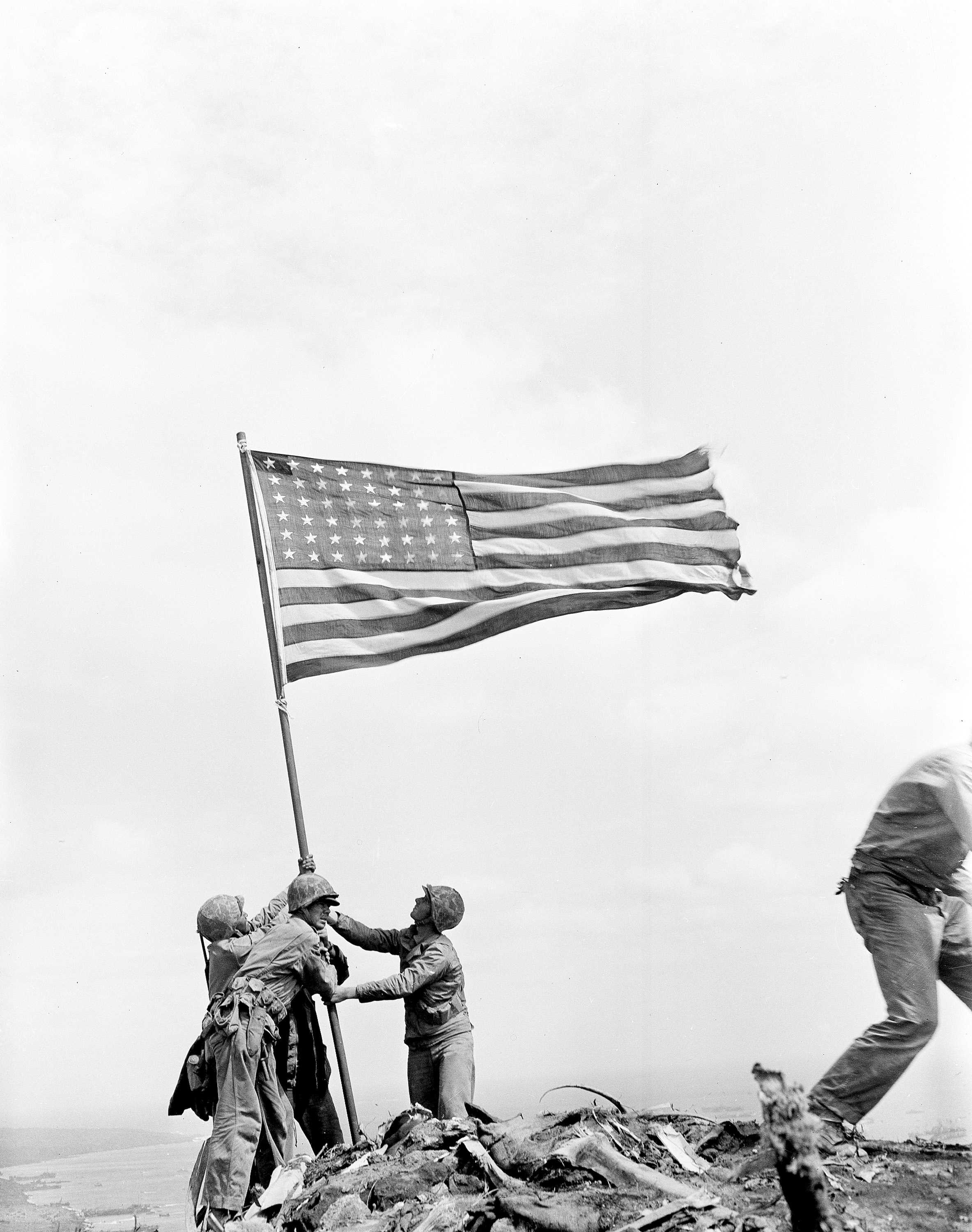 U.S. Marines of the 28th Regiment of the Fifth Division raise the American flag after capturing the 550-foot Mt. Suribachi on Iwo Jima, the largest Volcano Islands of Japan, on Feb. 23, 1945 during World War II.  (AP Photo/Joe Rosenthal)