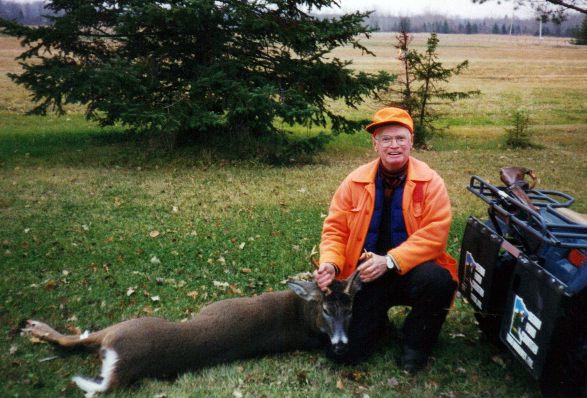 In this 2012 photo taken by Viola Hanson, George Krog poses with a buck he killed in Two Harbors, Minn. After a heart attack two years ago, Krog scaled back his hunting. Krogs request for a doe permit was turned away last fall _ the Department of Natural Resources limits how many doe permits it hands out by in order to protect the deer population. Senate Majority Leader Tom Bakk is pushing to allow residents 84 and older to take a doe without a special permit, giving Krog chance at getting another deer. (AP Photo/Courtesy of Viola Hanson)
