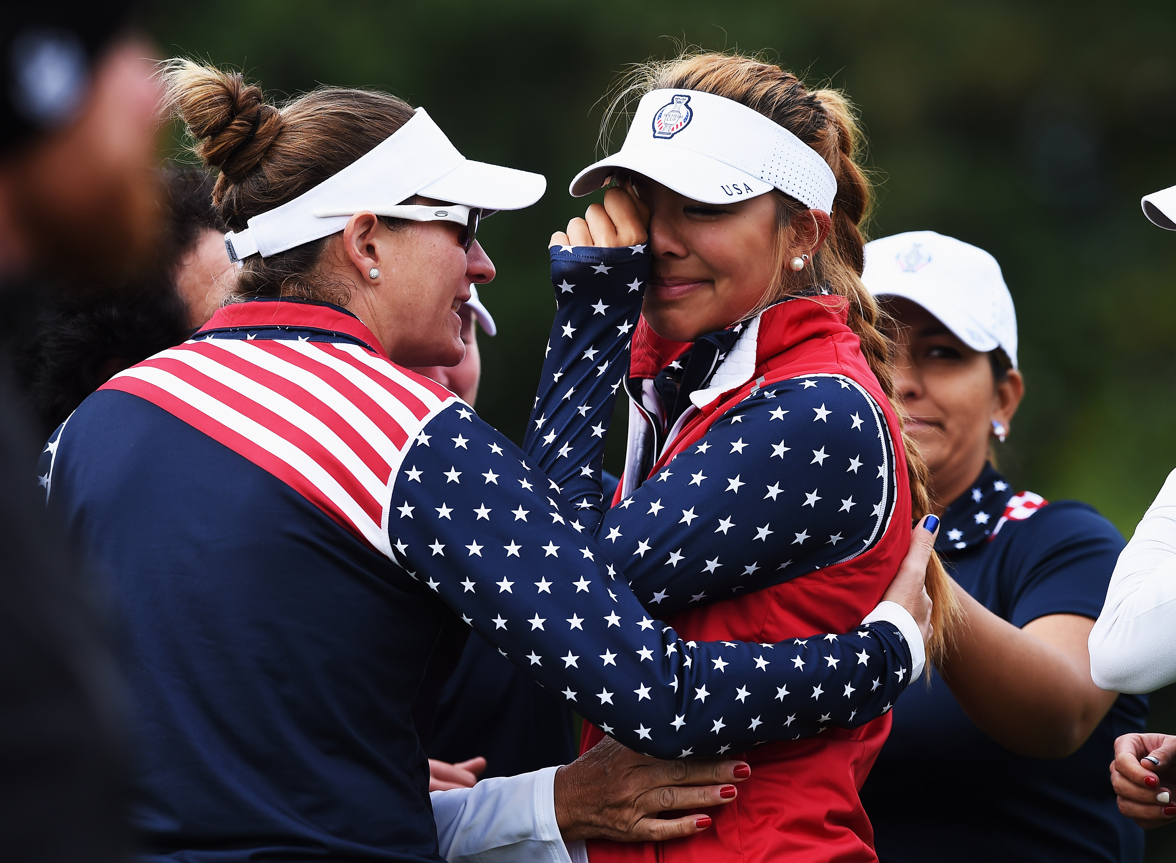 Alison Lee of team USA cries shortly afterwards she was told that her short putt on the 17th hole had not been conceeded and thus loosing the hole to Europe during the continuation of the darkness delayed afternoon fourball matches at The Solheim Cup at St Leon-Rot Golf Club on September 20, 2015 in St Leon-Rot, Germany. (Photo by Stuart Franklin/Getty Images)