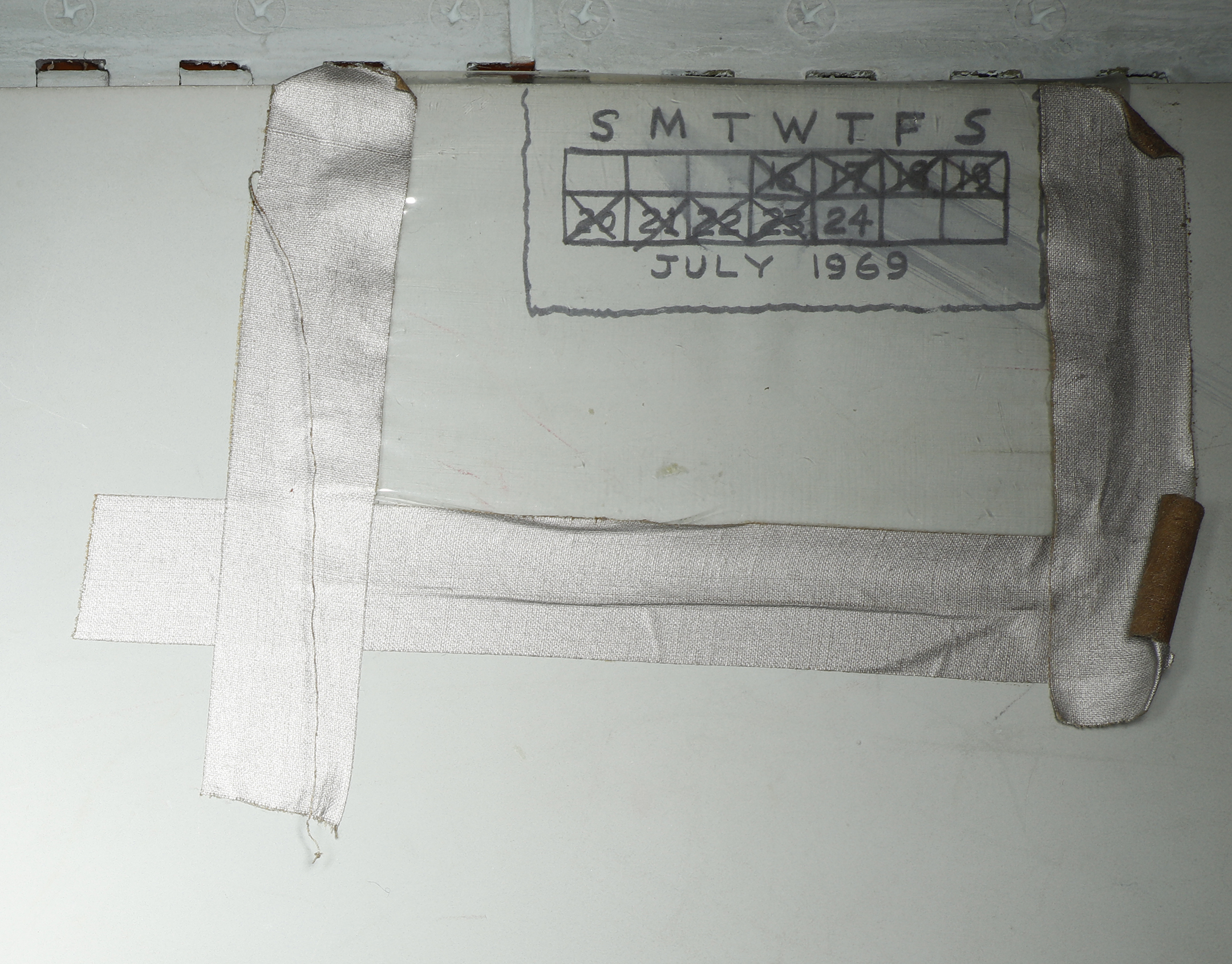 At some point during the mission, one of the astronauts created a small calendar on a smooth wall below one of the lockers. Each day of the Apollo 11 mission is crossed out except for landing day. The calendar is covered with a plastic sheet held by tape. Museum curators are in the process of trying to determine just when the calendar was drawn. Photo: Smithsonian Institution .