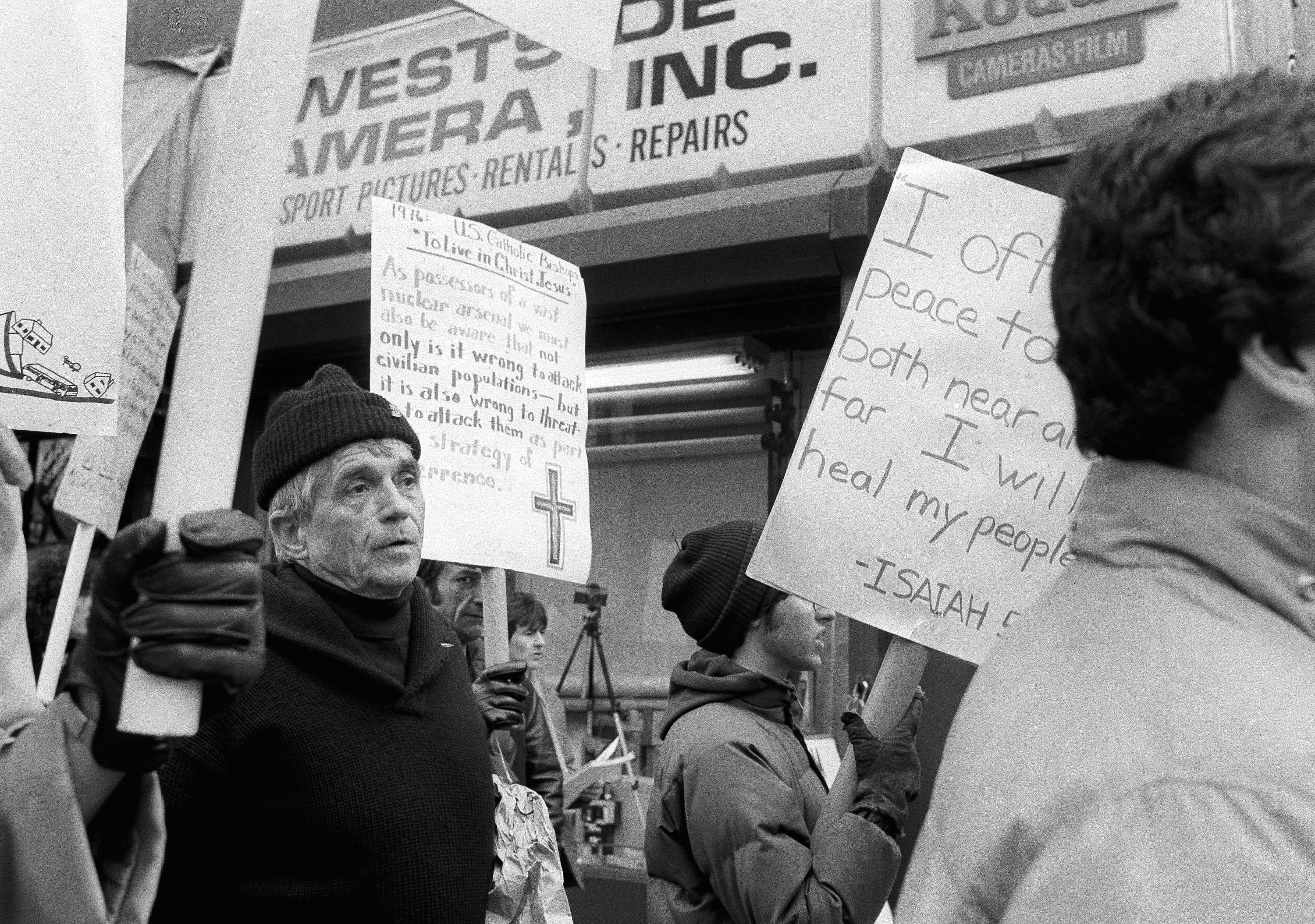 File-This April 9, 1982, file photo shows Daniel Berrigan marching with about 40 others outside of the Riverside Research Center in New York. The Roman Catholic priest and Vietnam war protester, Berrigan has died. He was 94. Michael Benigno, a spokesman for the Jesuits USA Northeast Province, says Berrigan died Saturday, April 30, 2016, at a Jesuit infirmary at Fordham University.  (AP Photo/Marty Lederhandler, File)