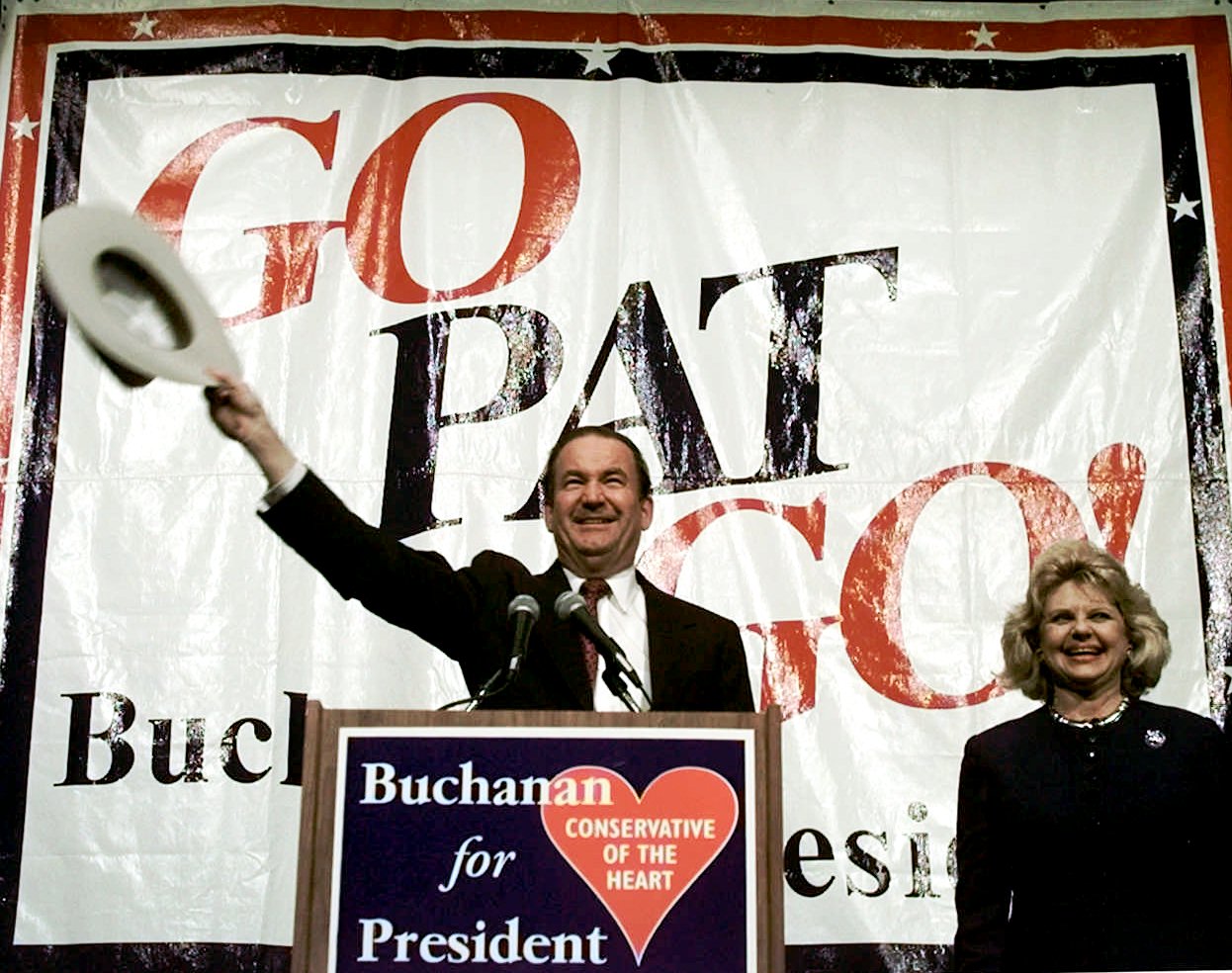 Pat Buchanan and wife Shelley acknowledge the crowd after their introduction at a rally in the George R. Brown Convention Center in Houston, Texas Saturday March 9, 1996. (AP Photo/ Michael S. Green)