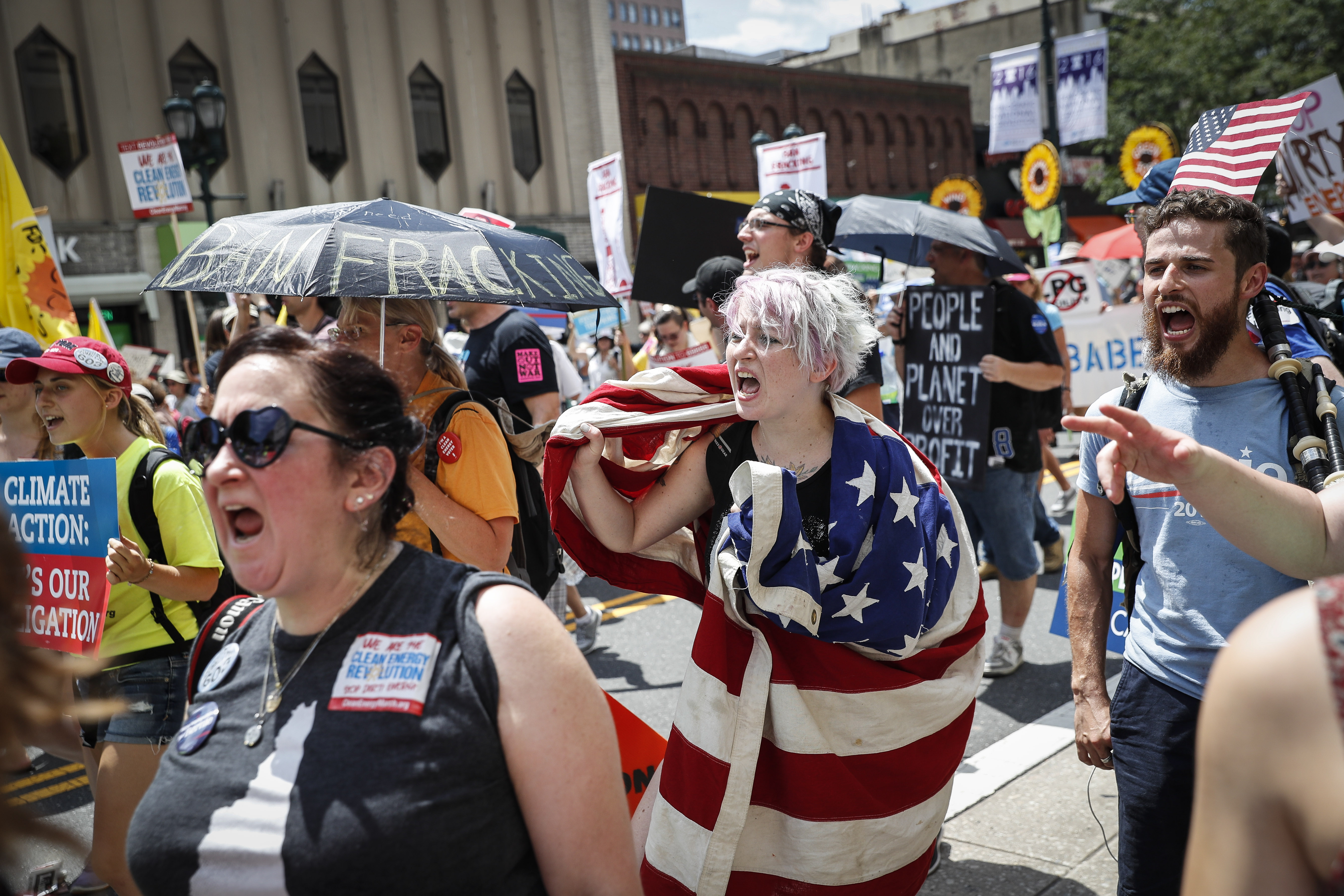 Protesters yell during a demonstration in downtown on Sunday, July 24, 2016, in Philadelphia. The Democratic National Convention starts Monday. (AP Photo/John Minchillo)