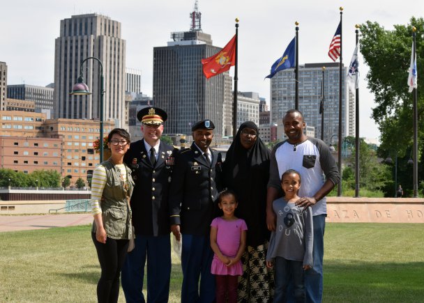  Ali Mohamed Dahir shown with his mother, brother, friend, nieces and Lt. Col. Joe Sharkey, 134th BSB commander. (Photo: Maj. Scott Ingalsbe) 