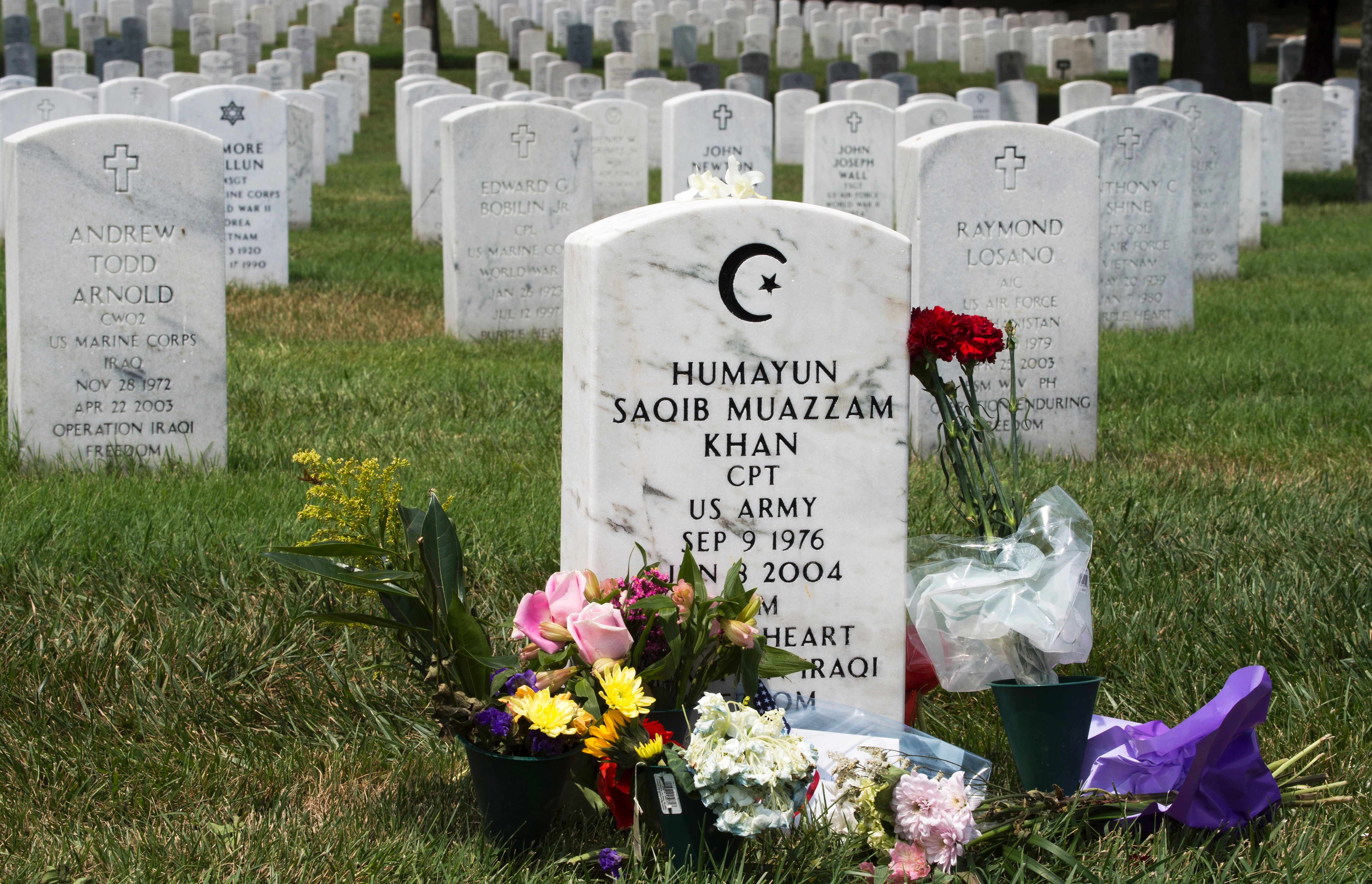 The grave marker for US Army Captain Humayun Saqib Muazzam Khan,who was killed in Iraq in 2004 in a roadside explosion, is seen August 1, 2016, in Section 60 of Arlington National Cemetery in Arlington, Virginia. The father of a slain Muslim American soldier assailed Donald Trump as a "black soul" July 31 in an impassioned exchange with the Republican presidential candidate over the qualities required in a US leader. Khizr Khan electrified the Democratic convention last week with a tribute to his fallen son that ended with a steely rebuke that Trump had "sacrificed nothing" for his country. Photo:   AFP / Paul J. Richards/Getty Images.        