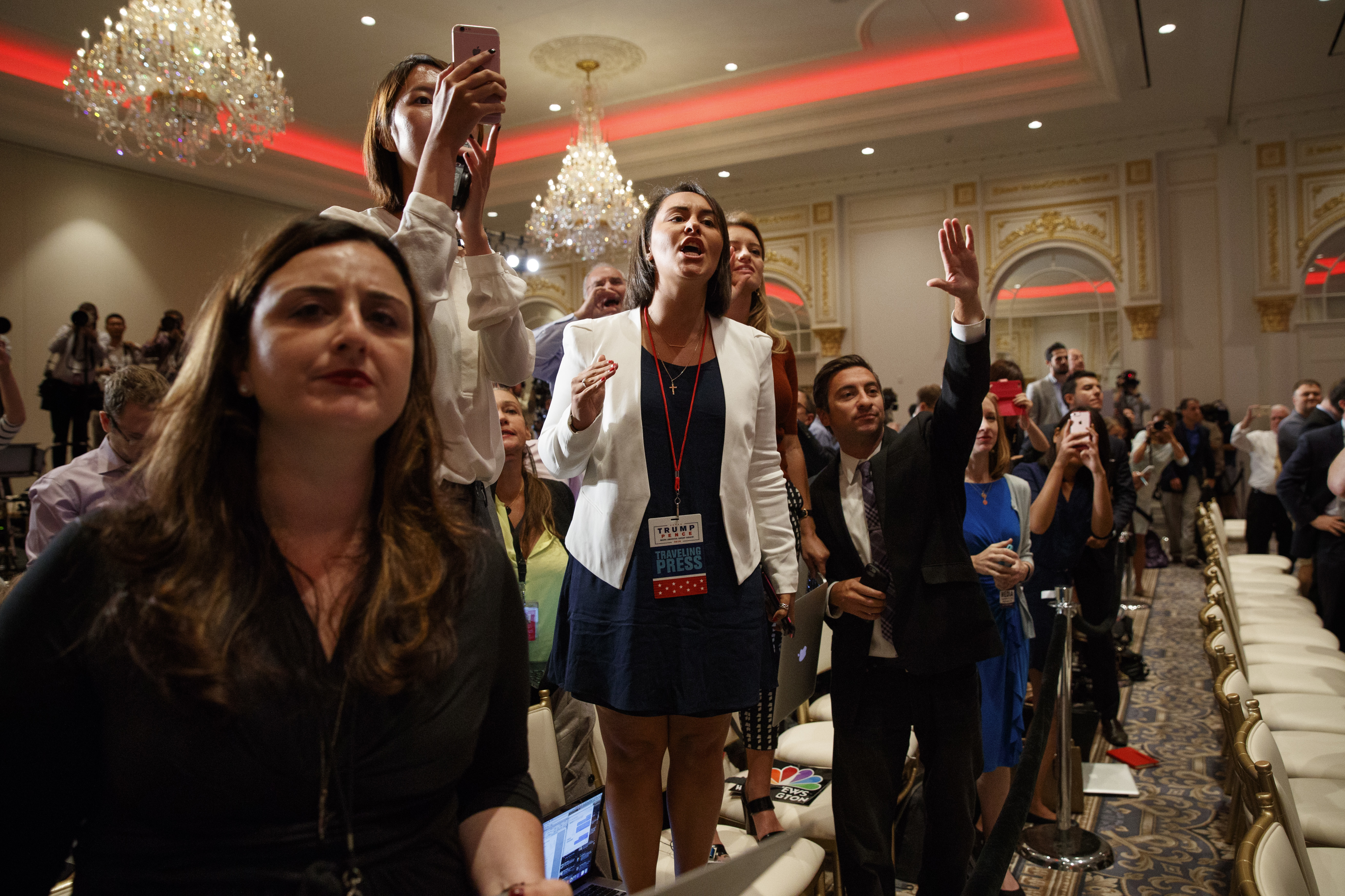 Reporters shout questions at Republican presidential candidate Donald Trump during a campaign event at Trump International Hotel, Friday, Sept. 16, 2016, in Washington. (AP Photo/ Evan Vucci)