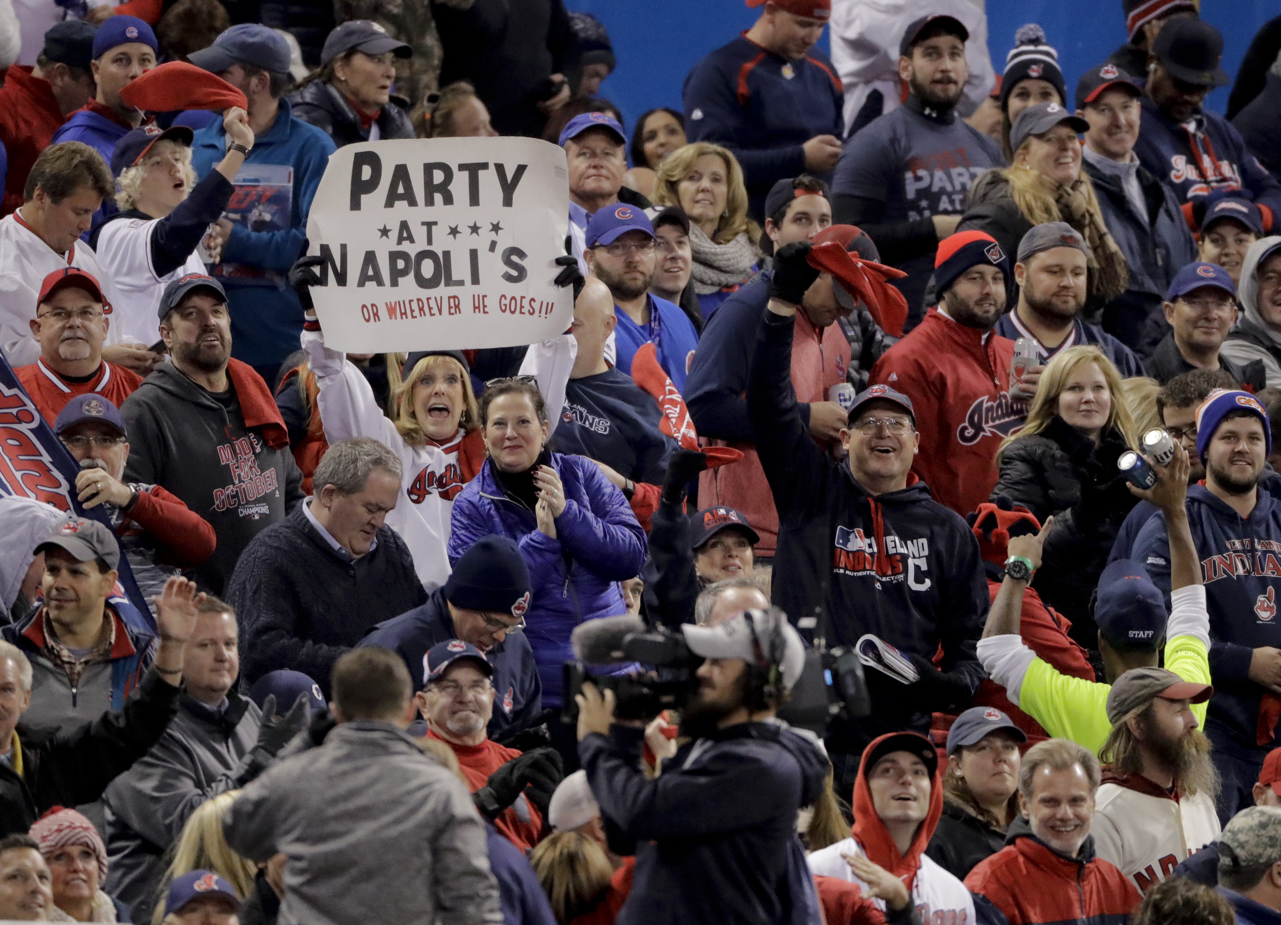 Fans cheer during the third inning of Game 1 of the Major League Baseball World Series between the Cleveland Indians and the Chicago Cubs Tuesday, Oct. 25, 2016, in Cleveland. (AP Photo/Charlie Riedel)