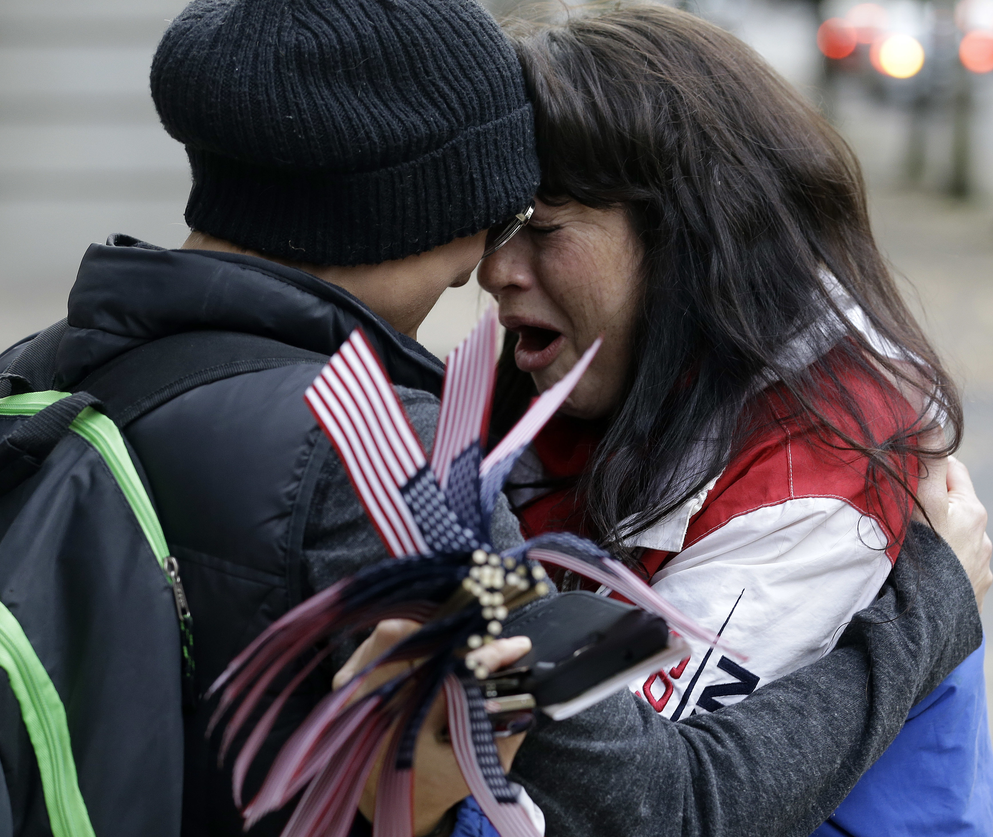 Maureen Valdez, right, cries and hugs another supporter after hearing a verdict outside federal court in Portland, Ore., Thursday, Oct. 27, 2016. A jury exonerated brothers Ammon and Ryan Bundy and five others of conspiring to impede federal workers from their jobs at the Malheur National Wildlife Refuge. (AP Photo/Don Ryan)