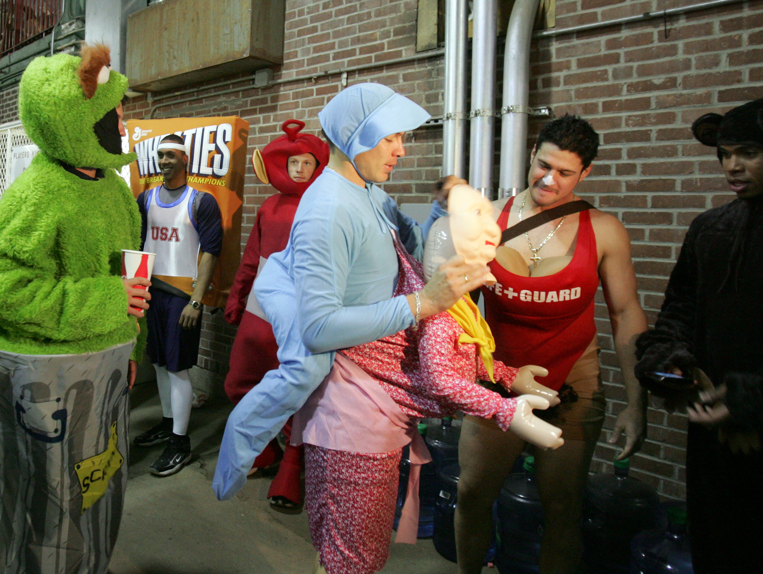 Cleveland Indians rookies mill about outside the club house at Fenway Park as part of a hazing event after their 6-2 loss to the Boston Red Sox in an MLB baseball game in Boston, Friday, Oct. 2, 2009. (AP Photo/Mary Schwalm)
