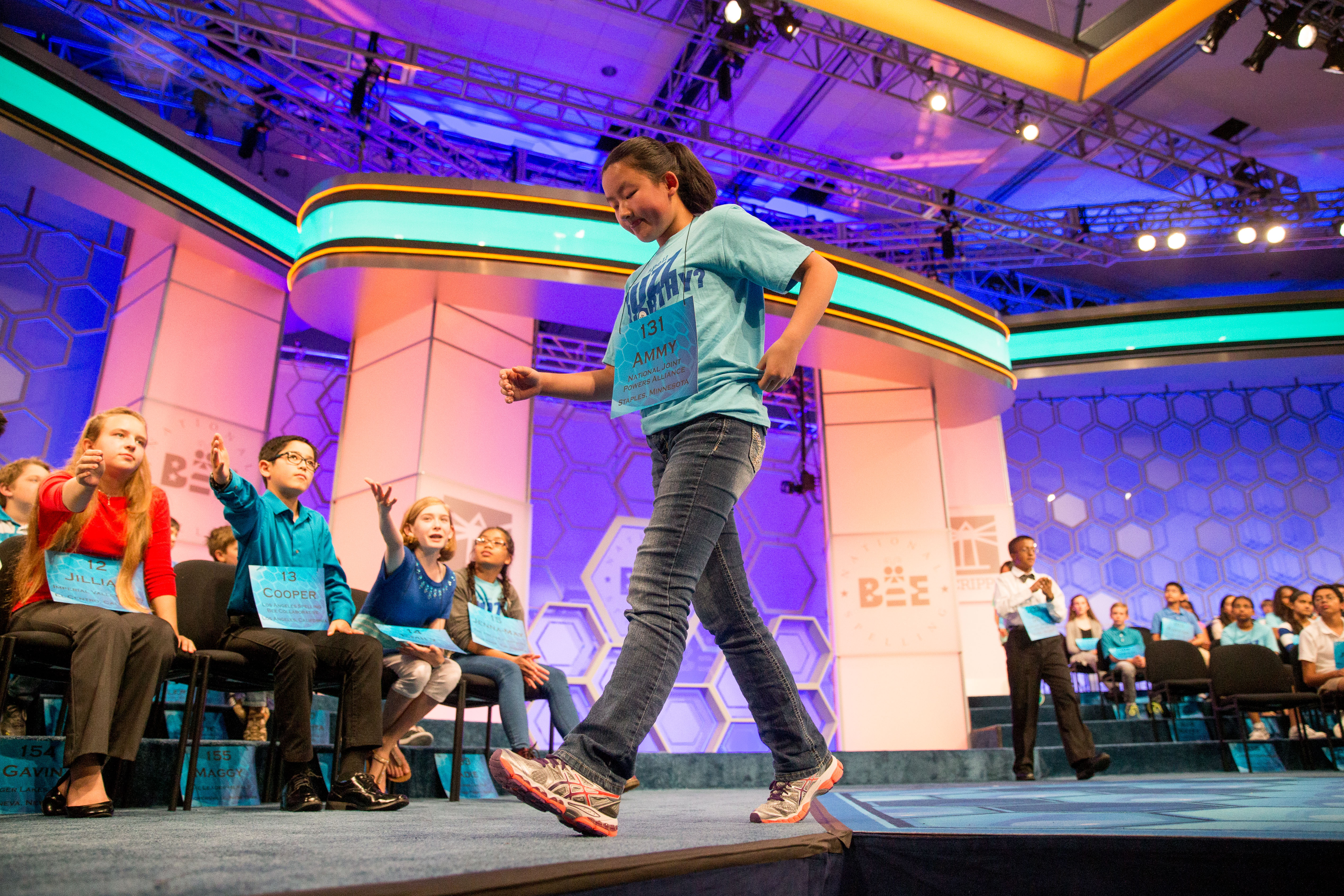Ammy Lin, 12, of Staples, Minn. leaves the stage after incorrectly spelling "colocynth" during the 2015 Scripps National Spelling Bee, Wednesday, May 27, 2015, in Oxon Hill, Md. (AP Photo/Andrew Harnik)