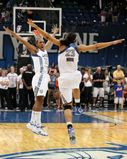 Minnesota Lynx guard Candace Wiggins (11) celebrates with teammate Maya Moore (23) after defeating the Tulsa Shock 92-83 in a WNBA basketball game, Friday, Aug. 31, 2012, in Minneapolis. (AP Photo/Genevieve Ross)
