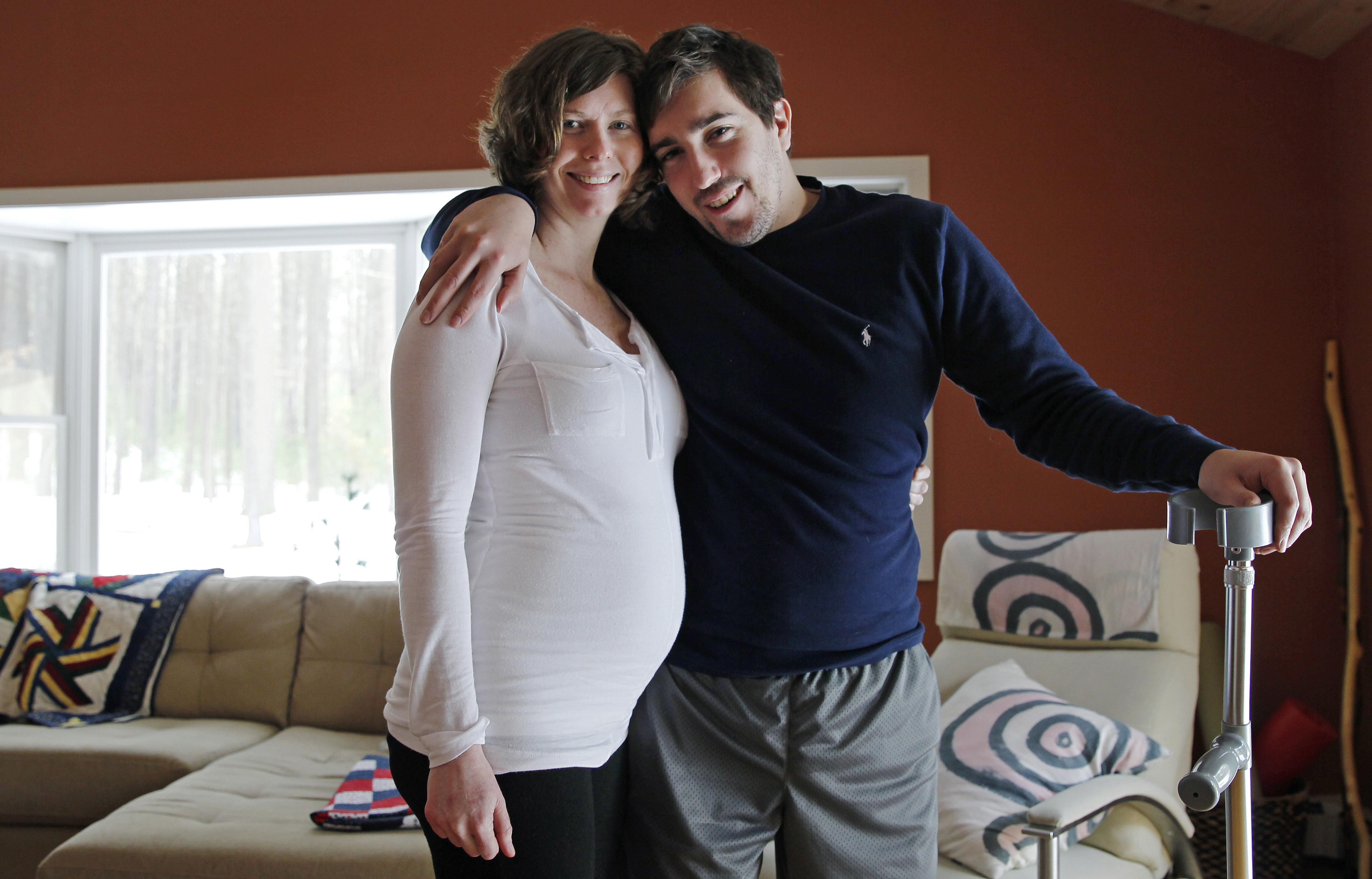 In this March 14, 2014 photo, Jeff Bauman, who lost both his legs above the knee in the Boston Marathon bombing, poses with his fiancee Erin Hurley at their Carlisle, Mass., home. (AP Photo/Charles Krupa)