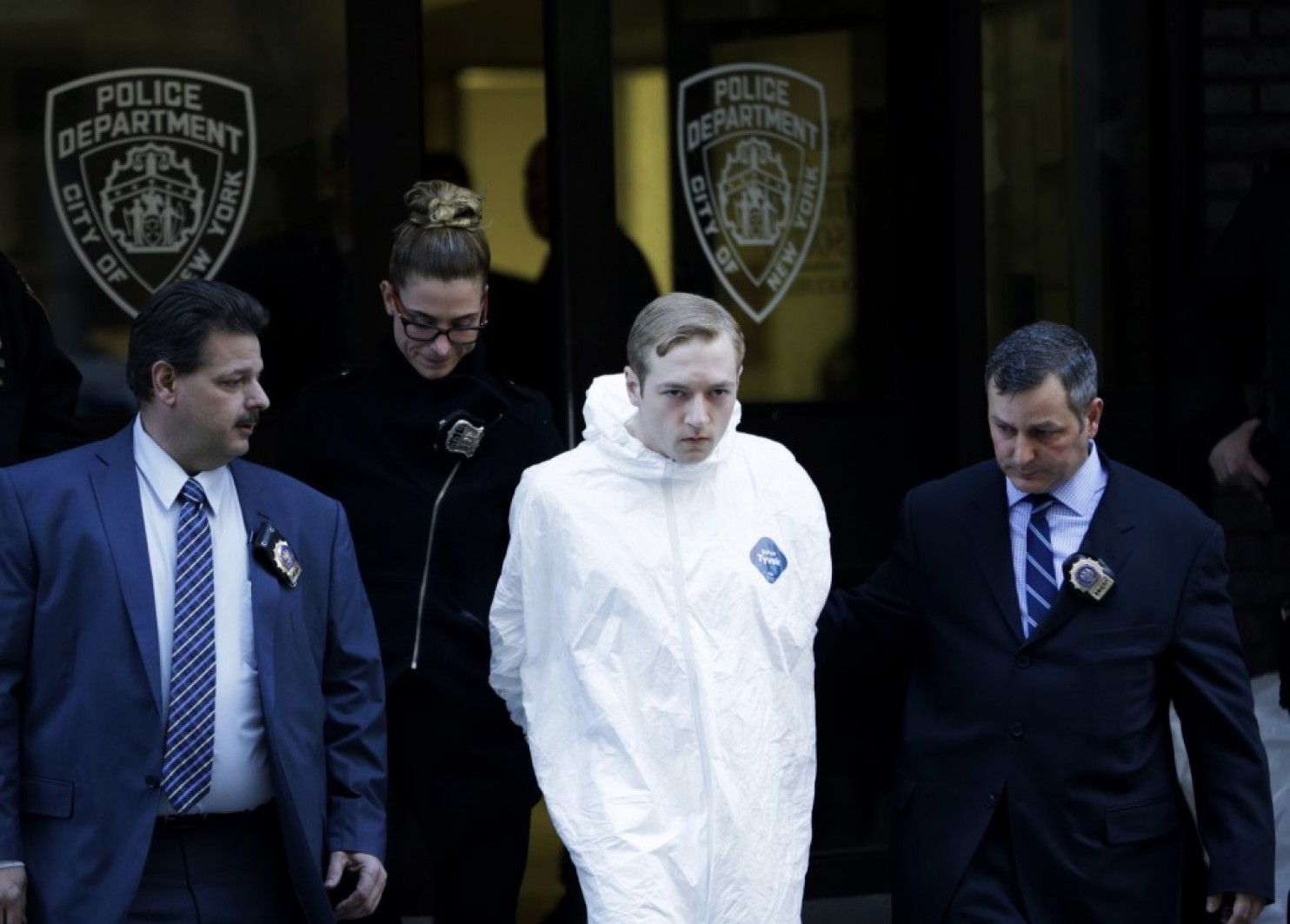James Harris Jackson is led out of a police precinct in New York. Photo: Seth Wenig | Associated Press.