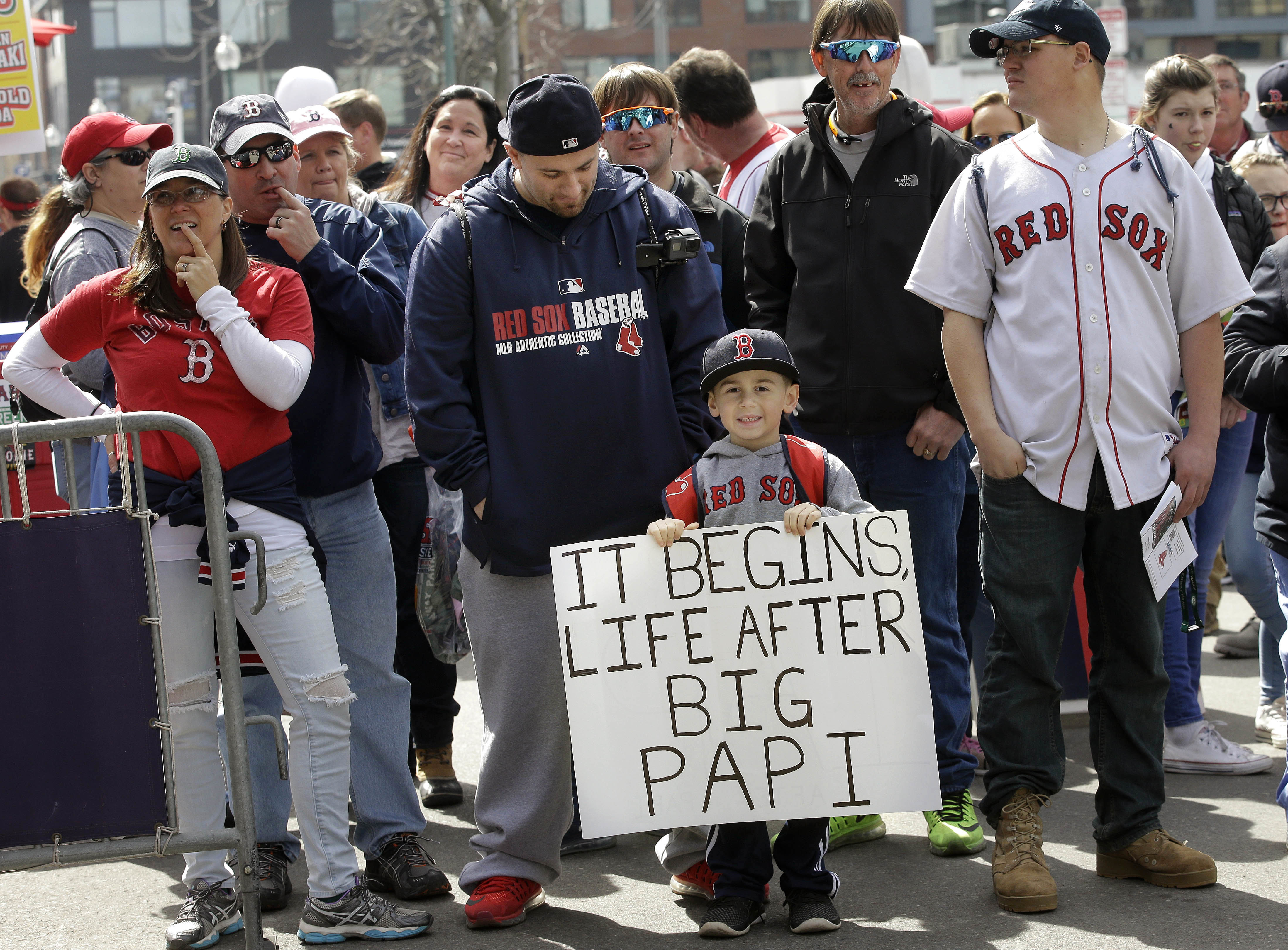 Travis Gonick, center, and his son T.J., both of Nutley N.J., wait with other fans to enter Fenway Park for a baseball game between the Boston Red Sox and the Pittsburgh Pirates on opening day, Monday, April 3, 2017, in Boston.  Steven Senne | Associated Press.