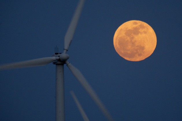 A perigee moon, or supermoon, rises behind wind turbines on May 5, 2012 near Palm Springs, Calif. (Getty Images)
