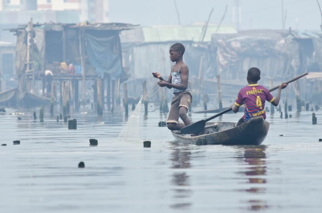Boys start fishing at a young age. Chief Emmanuel Shemede told me that education is the key to the neighborhood's future. "Makoko will be great," he said, adding that it's natives include lawyers and college gradutes who will "come back to fight" for it. (MPR Photo/Nate Minor)