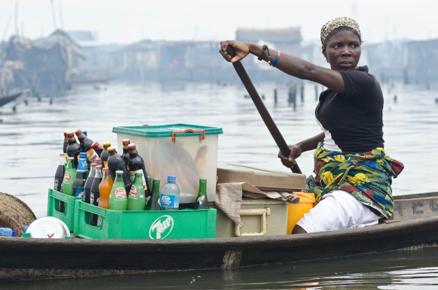 Many women paddle the streets of Makoko selling soda and other things seen on most of Lagos' busy streets. "We know how to make a living here," community leader Ayinde Joseph said. A Lagos-based advocacy group, the Social and Economic Rights Action Center, is fighting the state's efforts to relocate Makoko's residents. "We have hope in SERAC and we have hope in God," Joseph said. (MPR Photo/Nate Minor)