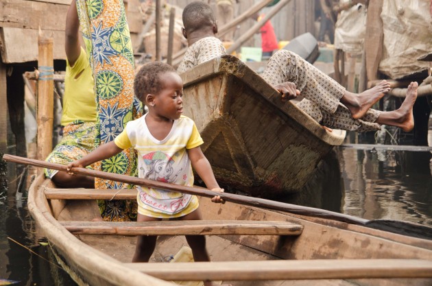 Living with water is a fact of life for Makoko's residents. Almost everything goes into the water -- trash, refuse, sunken boats -- with the exception of people. (MPR Photo/Nate Minor)